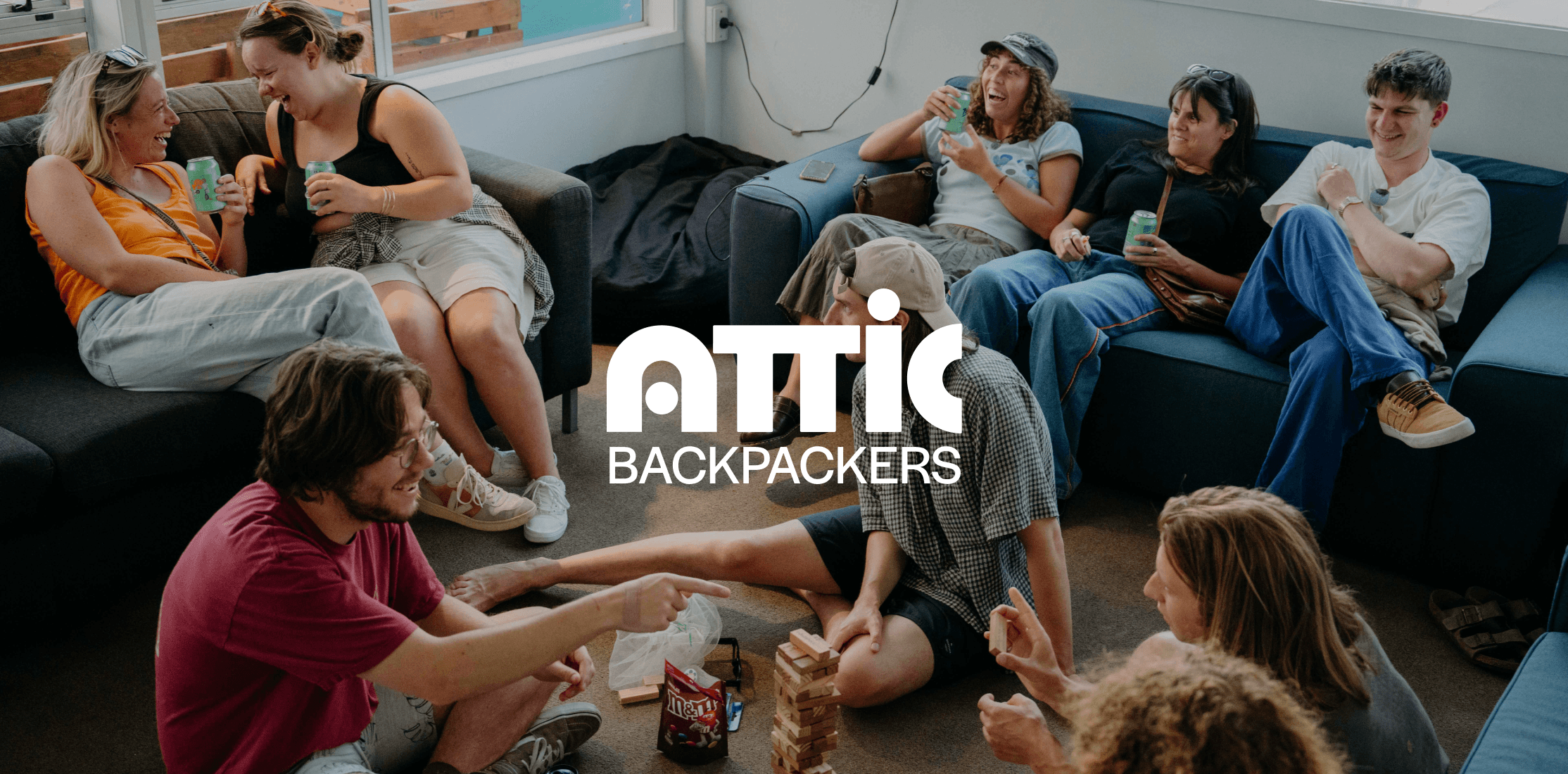 Group Photo of Attic's Guest with main Logo centered